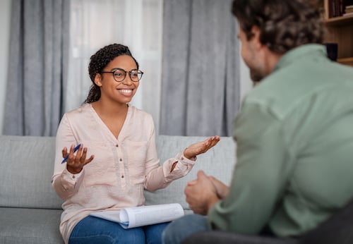A workplace culture of self-care can encourage licensed therapists, like the one shown here, to engage in talk therapy with a licensed psychologist and open up about any stressors in their personal life or work life