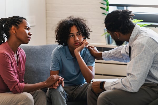 A therapist maintains direct eye contact with a patient during a session, allowing them to deliver more emotional support and further support their clients well-being