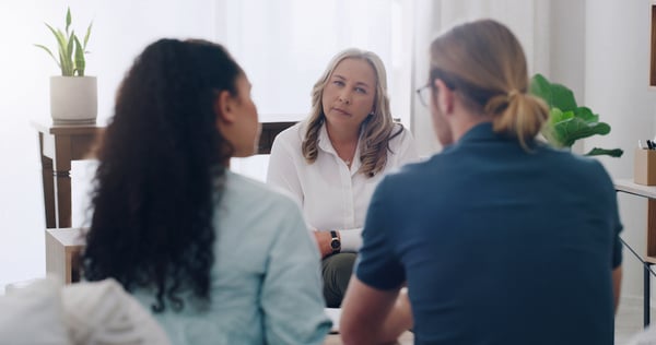 A therapist uses AI to document a therapy session, allowing them to maintain eye contact during the session and cut down documentation time, ultimately boosting employee morale in a competitive job market
