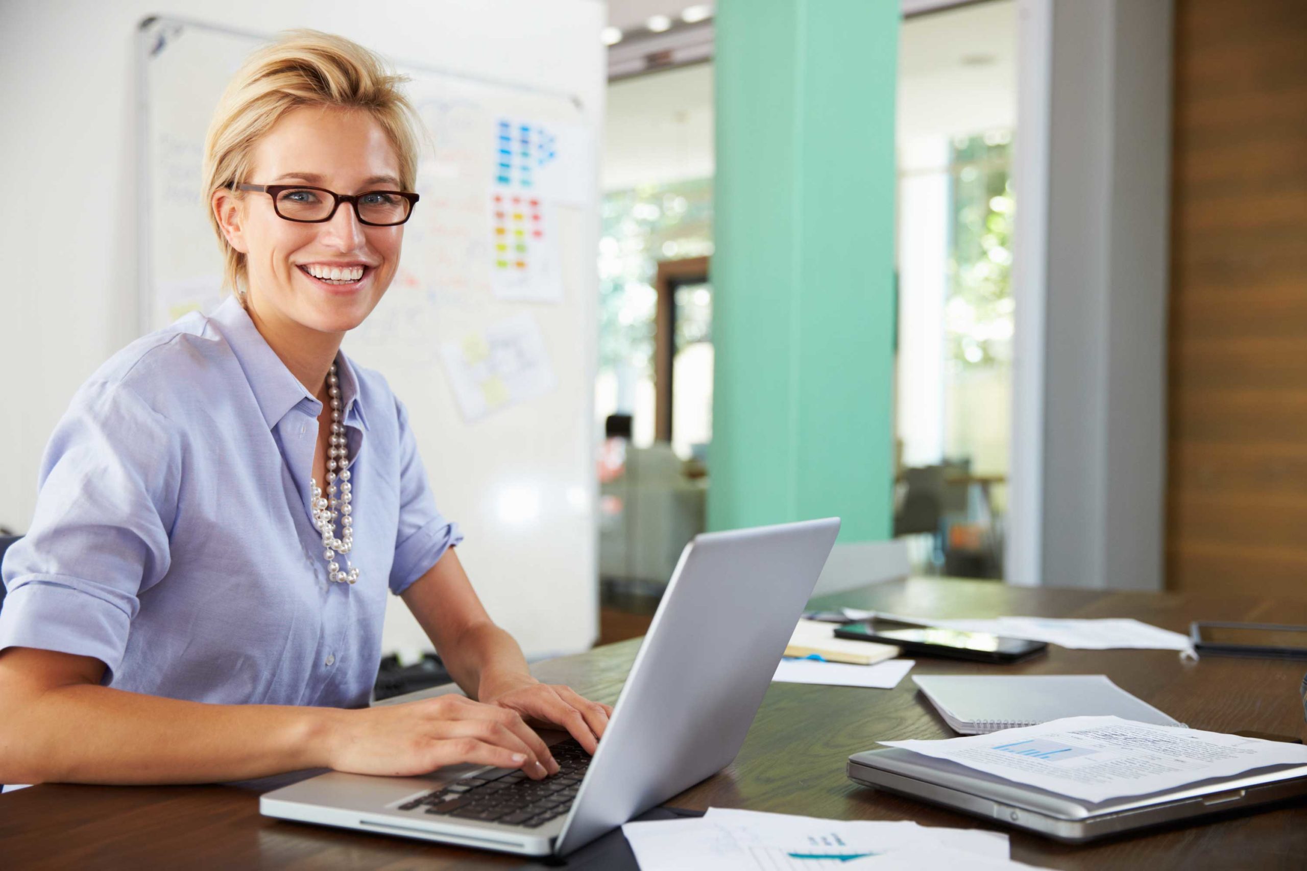 Image of a mental health professional using ClinicTracker's EHR system to manage student records efficiently, showcasing how software can empower mental health professionals