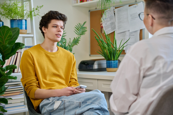 A counselor and student discussing medical and counseling care, using ClinicTracker academic counseling EHR